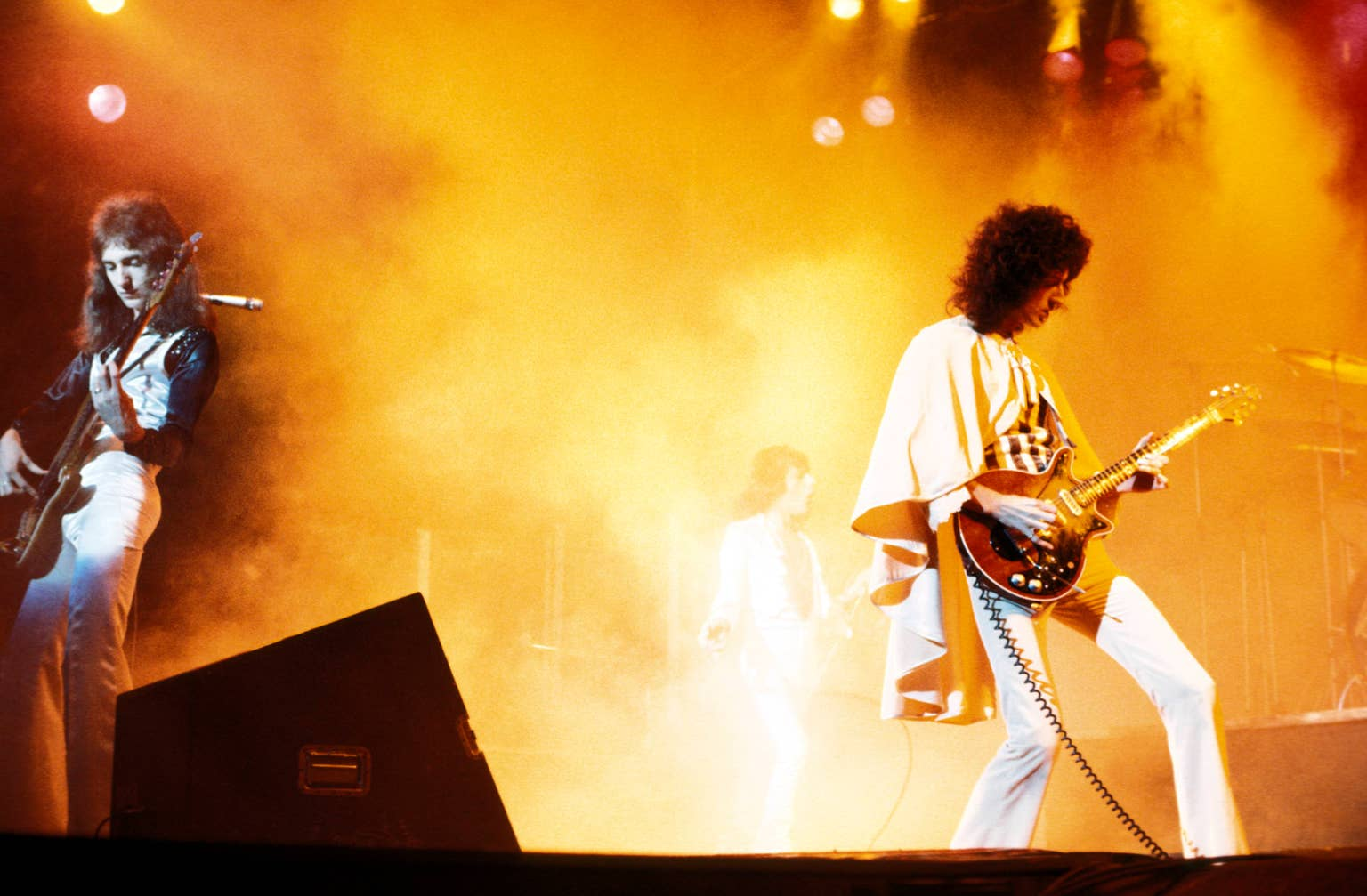 united-kingdom-november-29-hammersmith-odeon-photo-of-queen-l-r-john-deacon-freddie-mercury-and-brian-may-performing-on-stage-photo-by-andrew-putlerredferns-stockpack-gettyimages-1488881